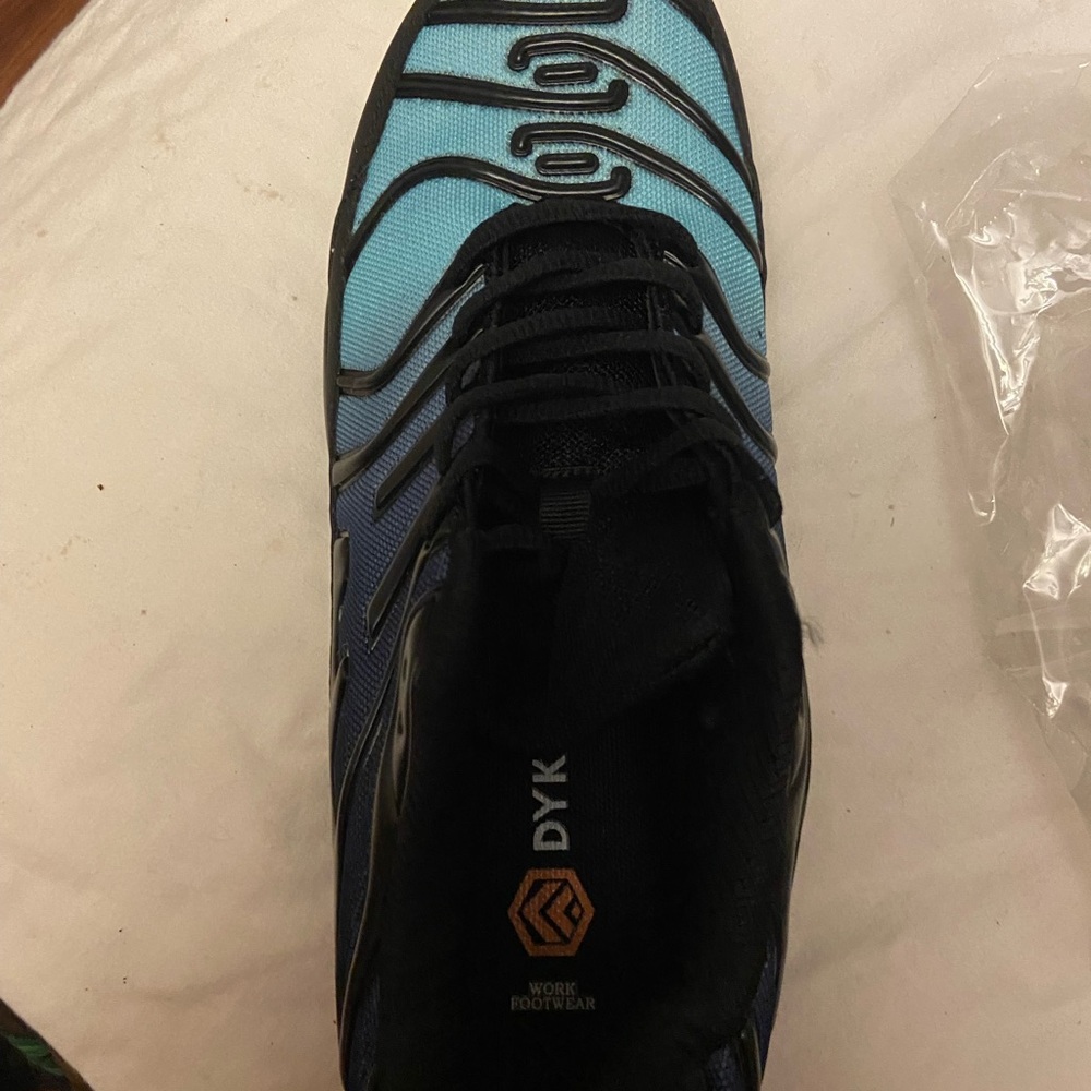 Black and Blue Athletic Shoes with Structured Design and Metallic Details